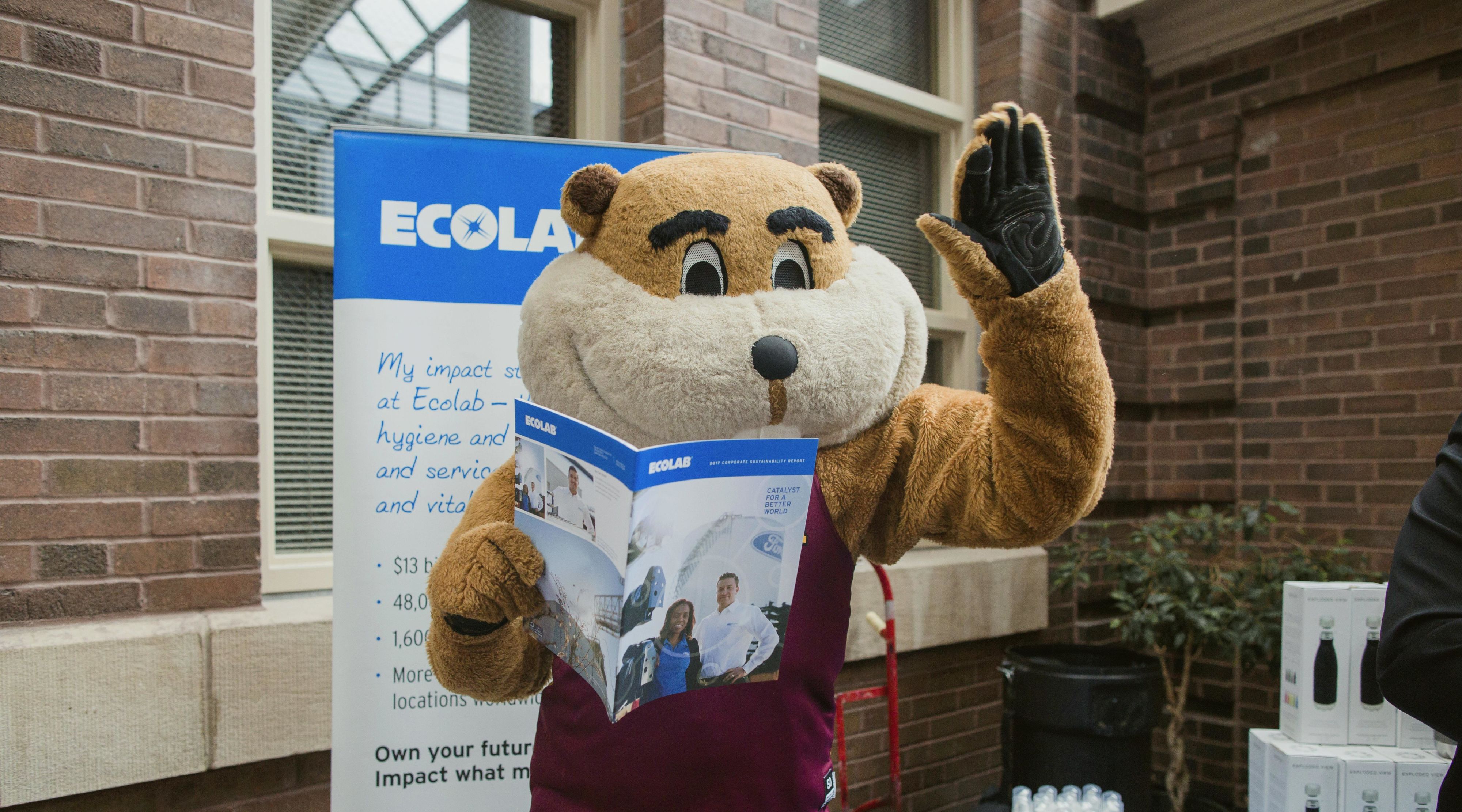 Goldy mascot in front of Ecolab signage
